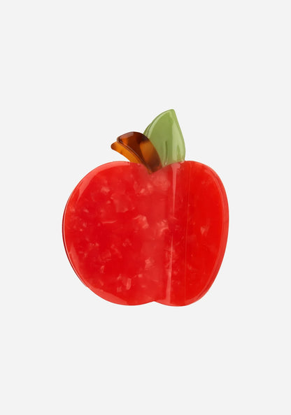 Hårklämma formad som ett rött äpple i marmorerad cellulosaacetat med grönt blad och sköldpaddsmönstrad stjälk, från Coucou Suzette