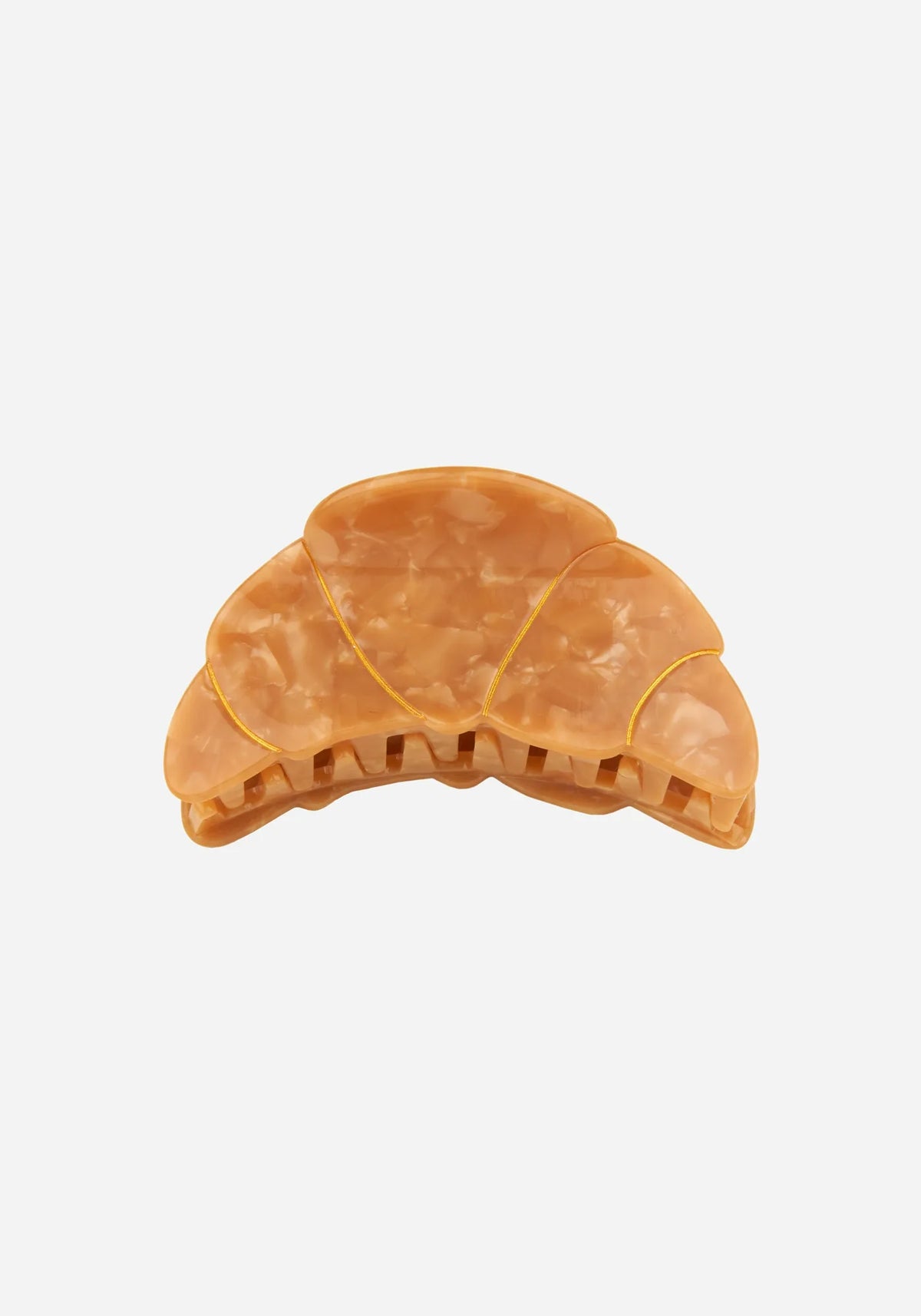 Hårklämma formad som en croissant i beige marmorerad cellulosaacetat med guldfärgade linjer, från Coucou Suzette