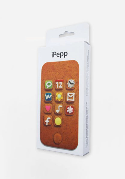 Förpackning till iPepp med bild av en pepparkaka dekorerad som en mobiltelefon, med appar i kristyr och godis.